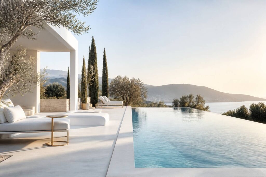 Piscine générique à débordement dans un jardin méditerranéen avec oliviers